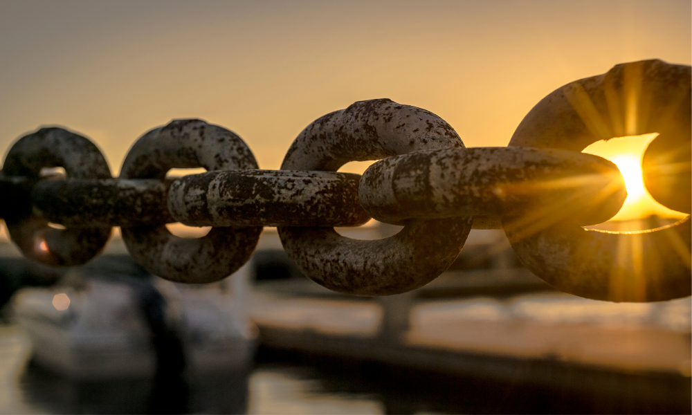 Rusty chain with sunlight shining through, symbolizing freedom from depression